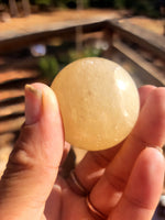 Honey calcite sphere