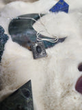 Crow vertebrae and feather locket