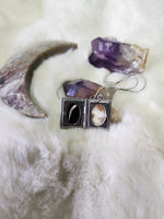 Diamond back rattlesnake fang locket