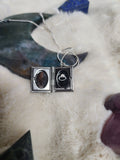 Crow vertebrae and feather locket