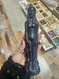 Woman spell working black candle