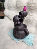 Triple cauldron backflow burner
