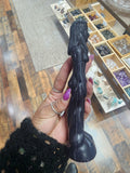 Woman spell working black candle