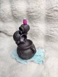 Triple cauldron backflow burner